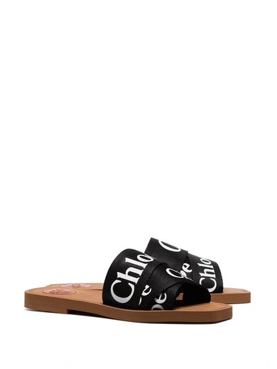 Shop Chloé Woody Logo Slides In Black