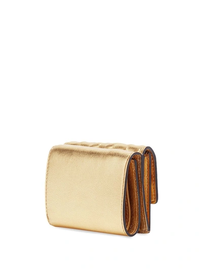 Shop Fendi Small Tri-fold Baguette Wallet In Gold