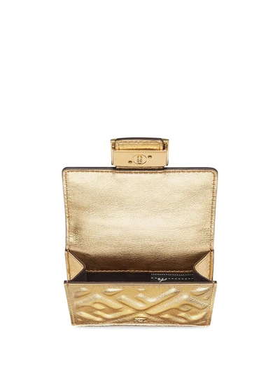 Shop Fendi Small Tri-fold Baguette Wallet In Gold