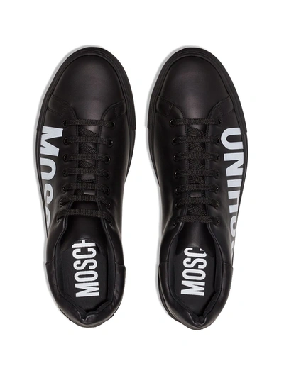 Shop Moschino Logo Low Top Sneakers In Black