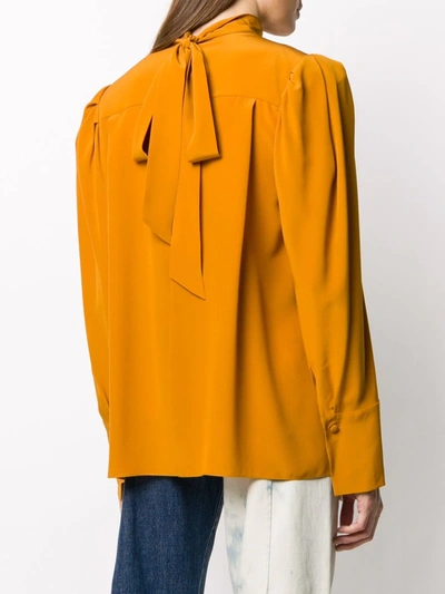 Shop Givenchy Button-embellished High-neck Blouse In Orange