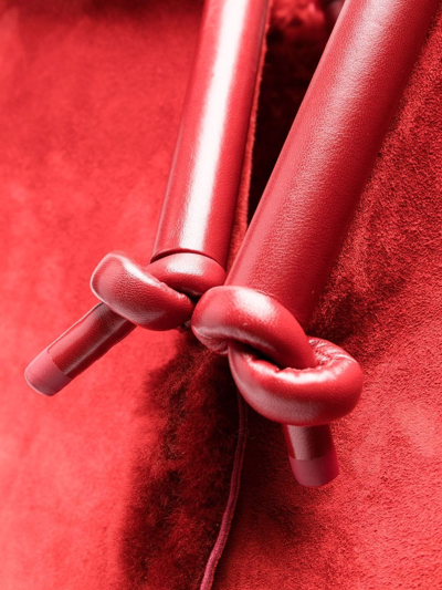 Shop Bottega Veneta Bolster Reversible Shearling Suede Bag In Red