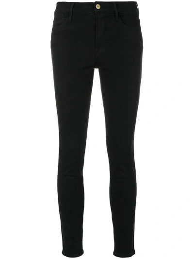 Shop Frame High Rise Skinny Jeans In Black