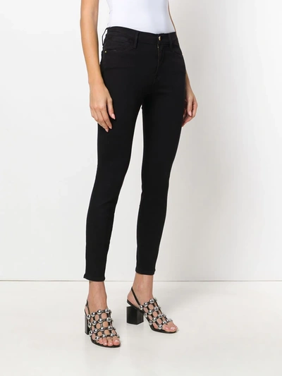 Shop Frame High Rise Skinny Jeans In Black