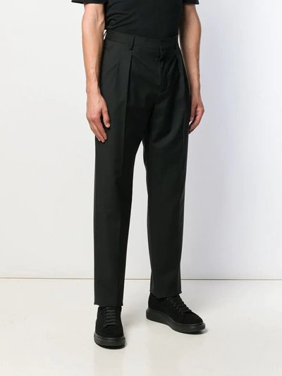 Shop Valentino Tapered Trousers In Black