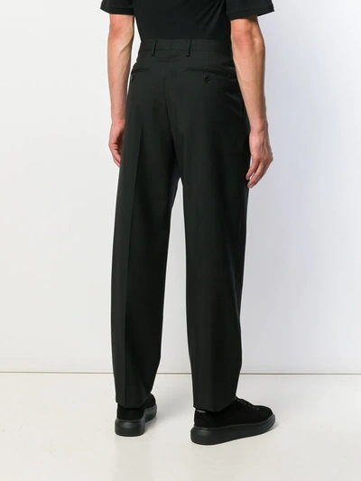 Shop Valentino Tapered Trousers In Black