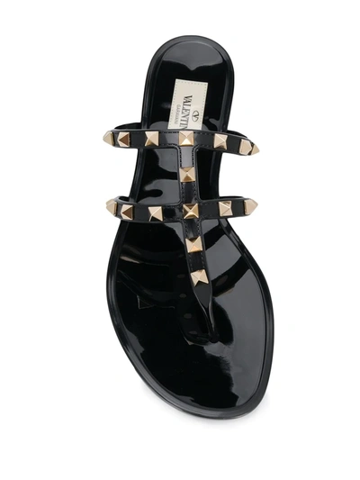 Shop Valentino Rockstud Flat Thong Sandals In Black