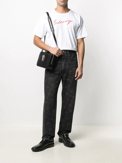 Shop Balenciaga Logo Print Straight-leg Jeans In Black