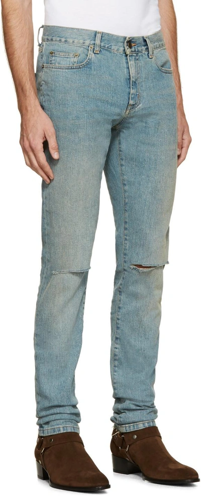 Shop Saint Laurent Blue Faded Ripped Jeans