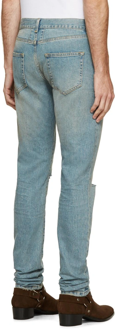 Shop Saint Laurent Blue Faded Ripped Jeans