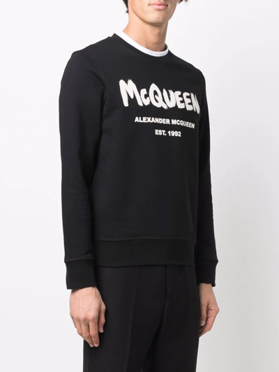 Shop Alexander Mcqueen Graffiti-print Sweatshirt In 黑色