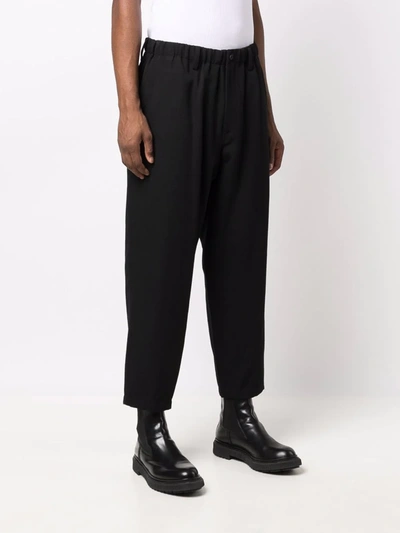 Shop Yohji Yamamoto Cropped Wool Trousers In 黑色