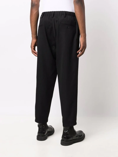 Shop Yohji Yamamoto Cropped Wool Trousers In 黑色