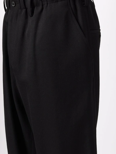Shop Yohji Yamamoto Cropped Wool Trousers In 黑色