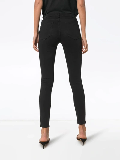 Shop Frame Le Color Skinny Jeans In Black