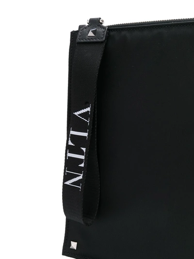 Shop Valentino Vltn Strap Clutch In Black