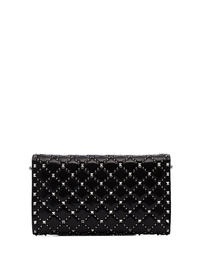 Shop Valentino Rockstud Spike Clutch Bag In Black