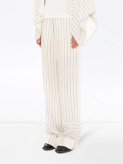 Shop Jw Anderson Patchwork Stripe Trousers In White