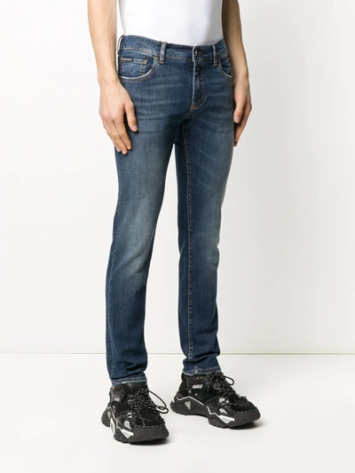 Shop Dolce & Gabbana Logo Plaque Low-waist Jeans In Blue