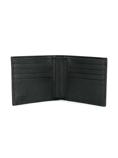 Shop Ferragamo Gancini Bi-fold Wallet In Black