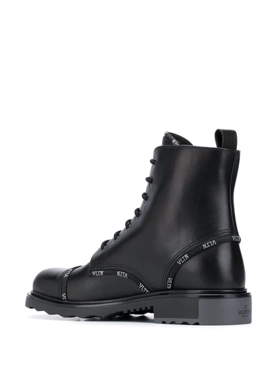 Shop Valentino Vltn-trim Combat Boots In Black
