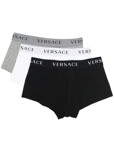 Shop Versace Pack Of Three Logo Waistband Boxer Shorts In Black