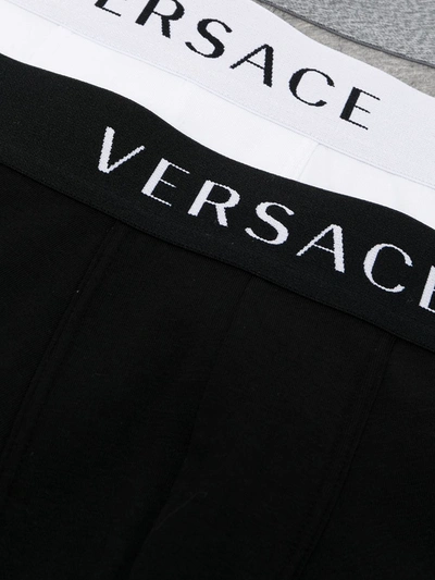 Shop Versace Pack Of Three Logo Waistband Boxer Shorts In Black