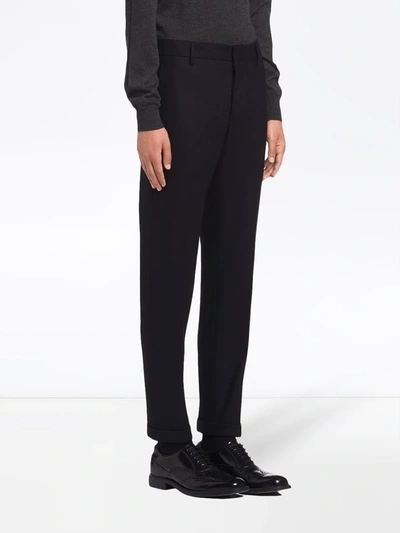 Shop Prada Jersey Trousers In Black