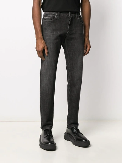 Shop Dolce & Gabbana Tapered Jeans In Black