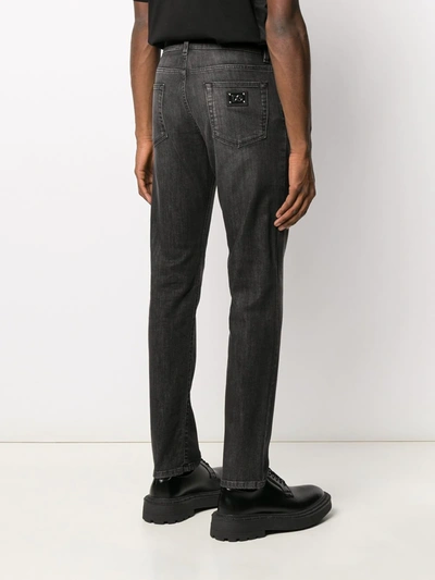 Shop Dolce & Gabbana Tapered Jeans In Black