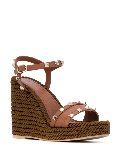 Shop Valentino Rockstud Leather Wedge Sandals In Brown