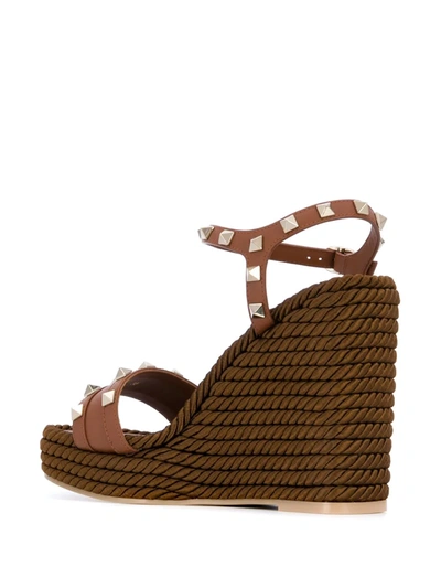 Shop Valentino Rockstud Leather Wedge Sandals In Brown