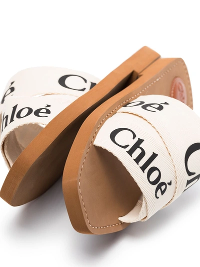 Shop Chloé Woody Logo Strap Slides In White