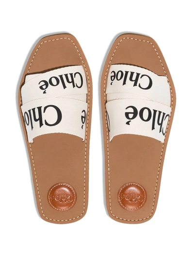 Shop Chloé Woody Logo Strap Slides In White