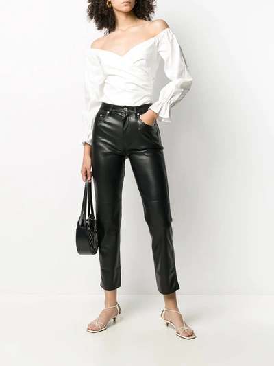 Shop Nanushka Faux-leather Trousers In Black