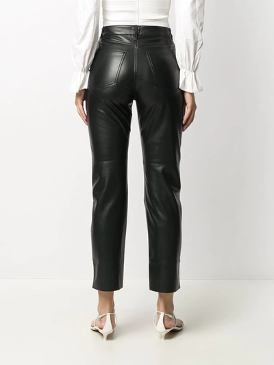 Shop Nanushka Faux-leather Trousers In Black