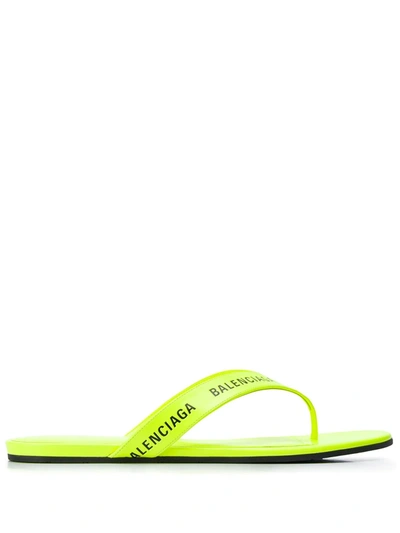 Shop Balenciaga Logo-strap Flip Flops In Yellow