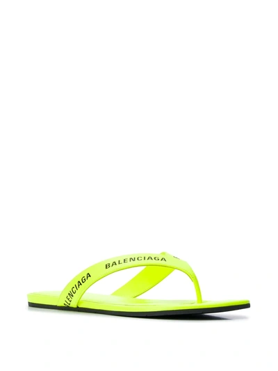 Shop Balenciaga Logo-strap Flip Flops In Yellow