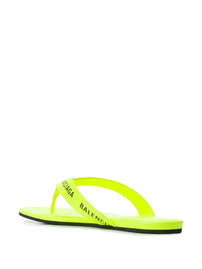 Shop Balenciaga Logo-strap Flip Flops In Yellow