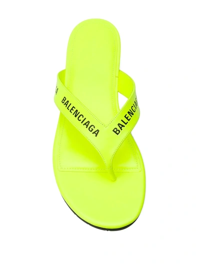 Shop Balenciaga Logo-strap Flip Flops In Yellow
