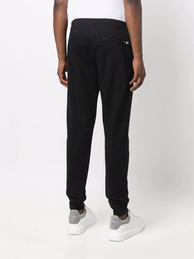 Shop Alexander Mcqueen Logo-print Cotton Track Trousers In 黑色