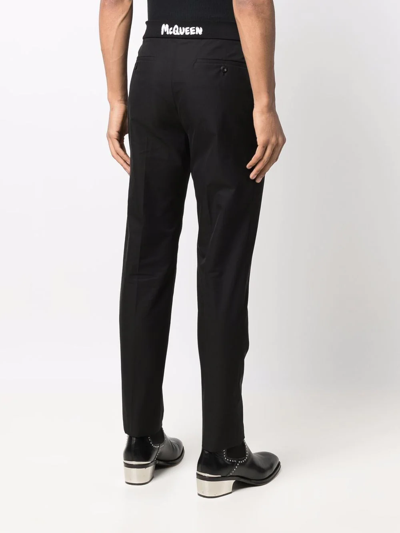 Shop Alexander Mcqueen Graffiti Logo Straight-leg Trousers In Black
