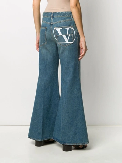 Shop Valentino Vlogo-print Flared Jeans In Blue