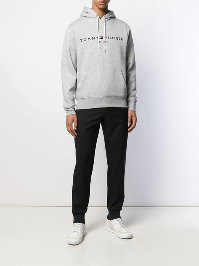 Shop Tommy Hilfiger Logo Embroidered Hoodie In Grey