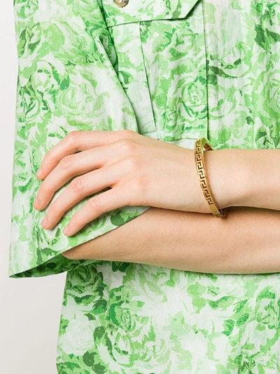 Versace Greca Brass Bangle Bracelet In 金色