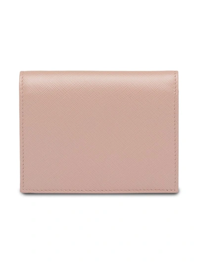 Shop Prada Saffiano Foldover Wallet In Pink