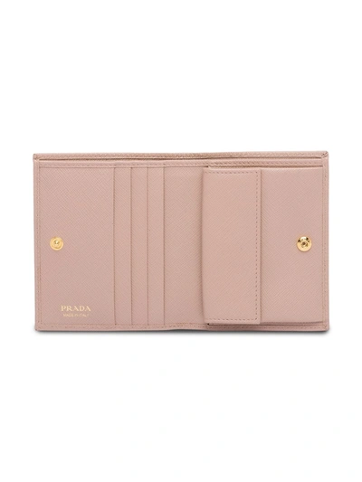 Shop Prada Saffiano Foldover Wallet In Pink