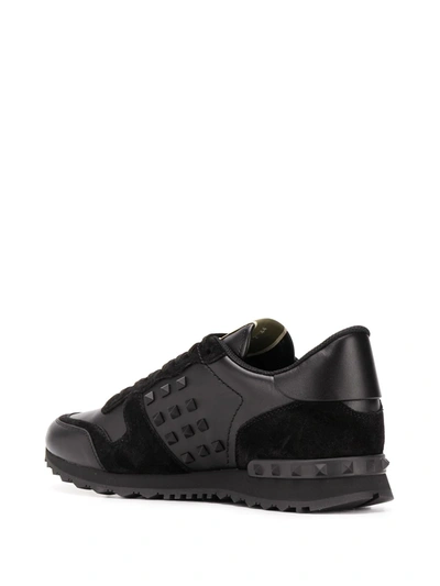 Shop Valentino Rockstud Low-top Sneakers In Black