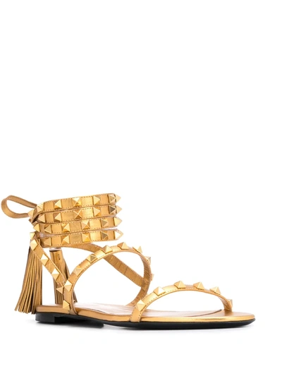 Shop Valentino Rockstud Flat Sandals In Gold