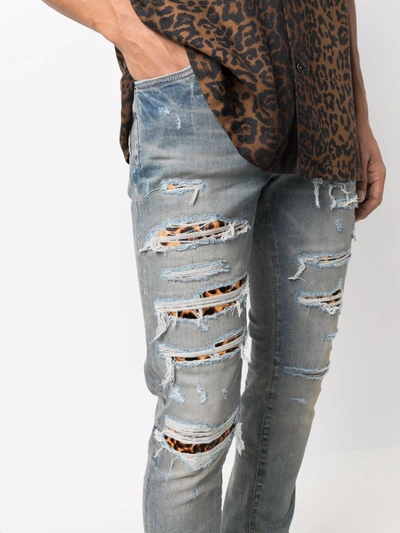 Amiri Distressed Stretch Denim Jeans In Blue | ModeSens